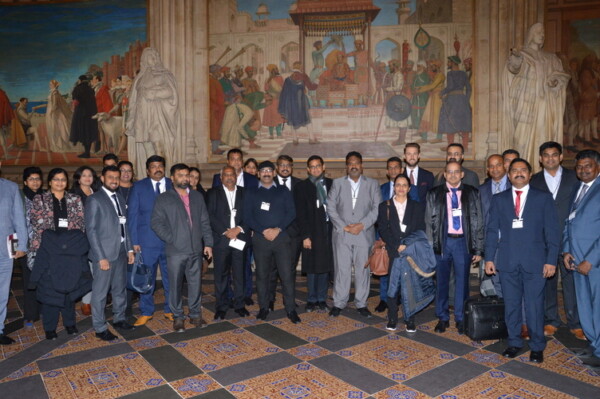 Panel at an earlier IBN event in Parliament, seated in front of an Indian Business Network banner
